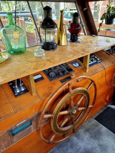 a wooden counter top with aokedokedokedoked at Péniche de charme avec jacuzzi sur canal du midi in Toulouse