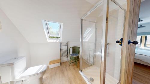 a bathroom with a shower and a toilet at The Sculptors Studio in Long Hanborough