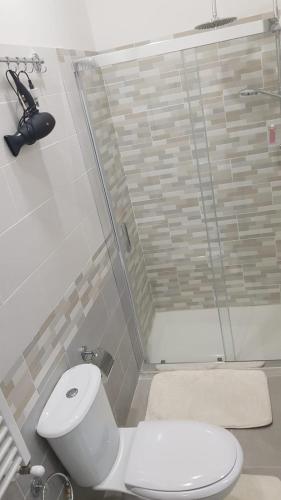 a bathroom with a toilet and a shower at BeB575 in Messina