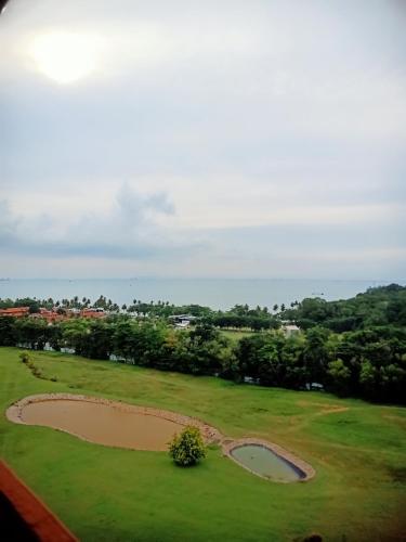 a view of a golf course with a pond at The Nove Apartment Nuvasa Bay - Kaina Tower Junior Penthouse in Nongsa