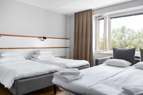Postel nebo postele na pokoji v ubytování Best Western Plus Park City Solna