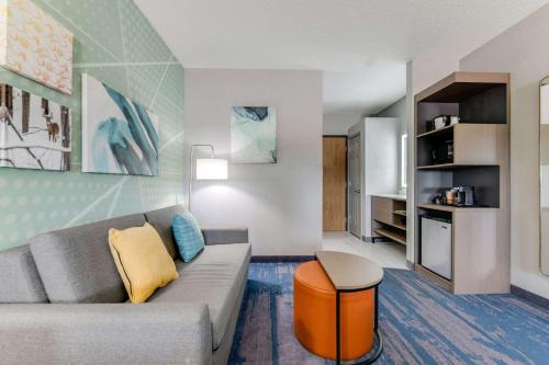 a living room with a couch and a table at Comfort Inn & Suites Weston - Wausau in Weston