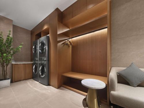 a laundry room with a washer and dryer at Hilton Garden Inn Xi'An Bell Tower in Xi'an