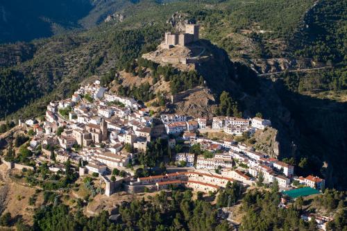 an aerial view of a town on a mountain at Cortijo De Ramón in Cortijos Nuevos