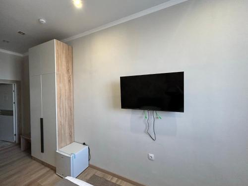 TV a/nebo společenská místnost v ubytování Amal Hotel
