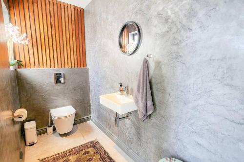 a bathroom with a sink and a toilet at 10 Seaview Close, Shelley Point in St Helena Bay