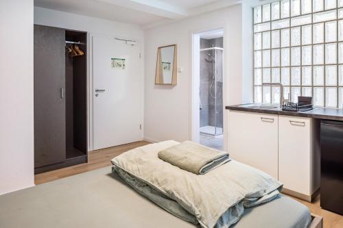 Postel nebo postele na pokoji v ubytování Mcello Apartments