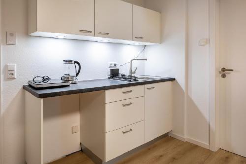 Kuchyň nebo kuchyňský kout v ubytování Mcello Apartments