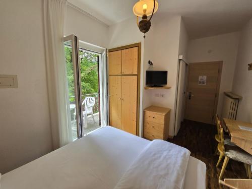 Ένα ή περισσότερα κρεβάτια σε δωμάτιο στο Lago Park Hotel
