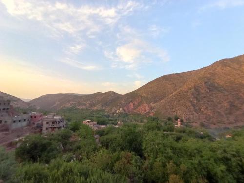 a view of a village in the mountains at Gite Gougadir Imoughlad in Imlil