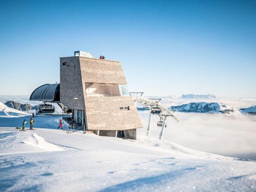 a building on the top of a snow covered mountain at Apartment Christine by Interhome in Brixlegg