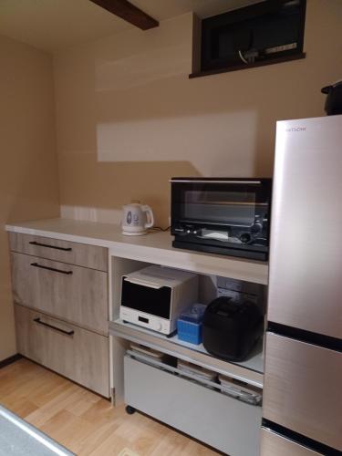 Una cocina o zona de cocina en 前の家おさき