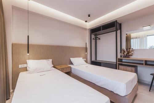 Ένα ή περισσότερα κρεβάτια σε δωμάτιο στο Villa Infinity Theo