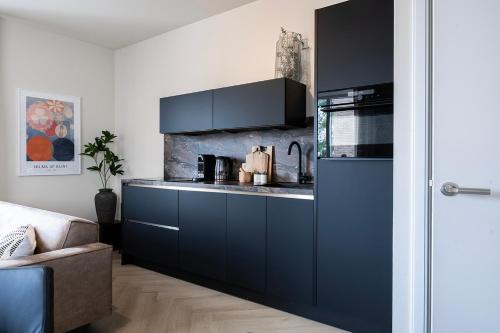 Kuchyň nebo kuchyňský kout v ubytování Prestigious Designer Apartment All In