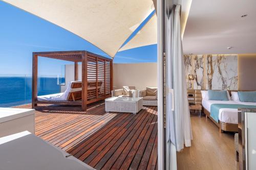 a room with a balcony on a yacht at Hotel Torre del Mar - Ibiza in Playa d'en Bossa