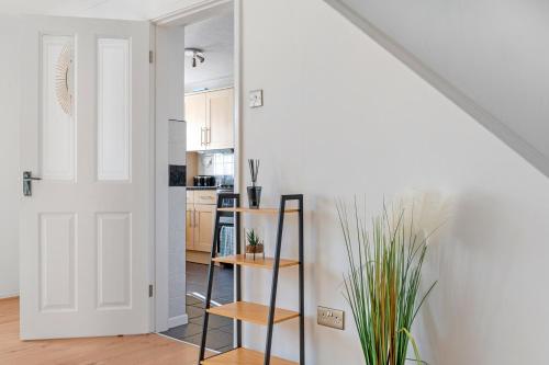 a room with a staircase and a white door at The Marlowe Stay in Nottingham
