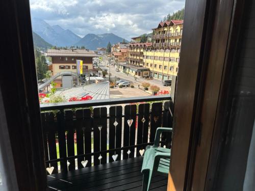 a balcony with a view of a city at Hotel Garni St. Hubertus in Madonna di Campiglio