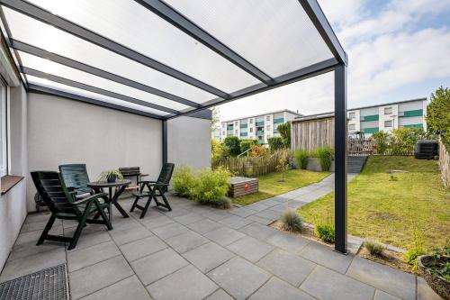a patio with a table and chairs at Ferienbungalow Süssau in Süssau