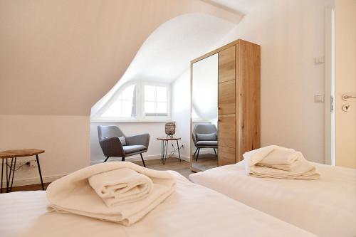 Postel nebo postele na pokoji v ubytování Sandregenpfeifer