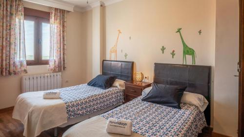 Ένα ή περισσότερα κρεβάτια σε δωμάτιο στο Casas Rurales Medina Granada by Ruralidays