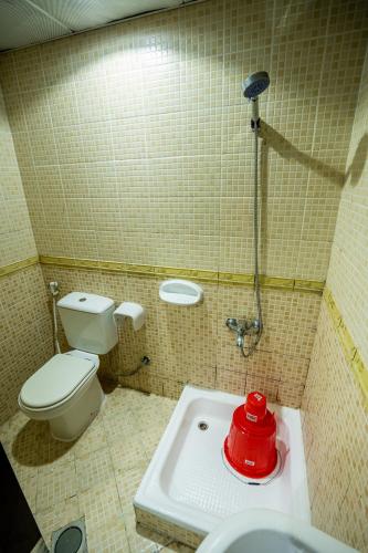 a small bathroom with a toilet and a sink at tourist Peaceful Family Rooms Abu Dhabi ME11APT baith al jannah LLC in Abu Dhabi