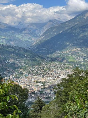 a view of a city with mountains in the background at La Casetta in Gressan