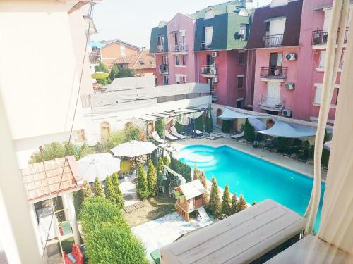 a view of a pool from a balcony of a building at Red Clay Apartments City Club in Belgrade