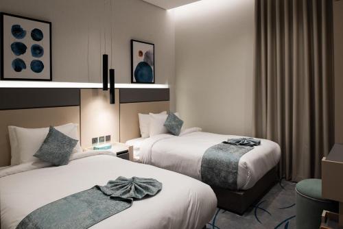 Кровать или кровати в номере أجنحة لفيف السلام - Lafif Apartments-Al-Salam