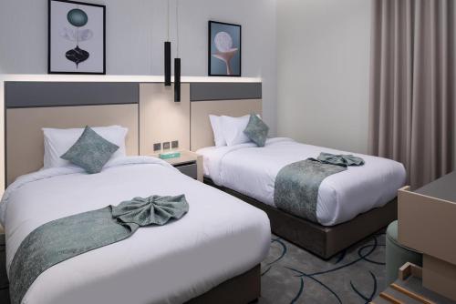 Кровать или кровати в номере أجنحة لفيف السلام - Lafif Apartments-Al-Salam