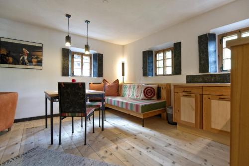 a living room with a couch and a table at Der Gannerhof in Innervillgraten