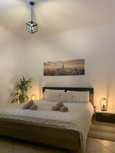 a bedroom with a bed with two pillows on it at Kite Village Solaris in Birgi Vecchi