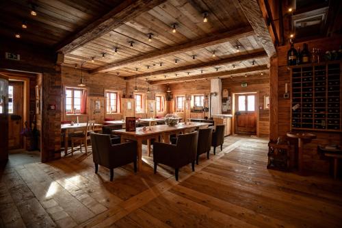 a large dining room with a table and chairs at Der Gannerhof in Innervillgraten