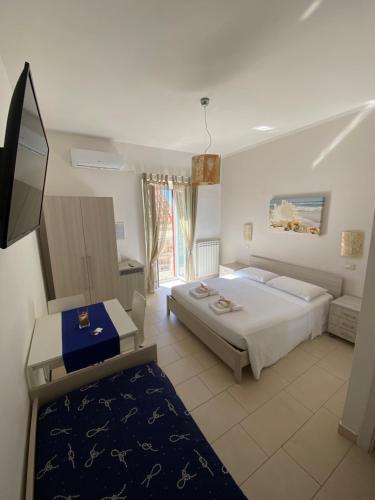 Postel nebo postele na pokoji v ubytování B&B degli Aranci