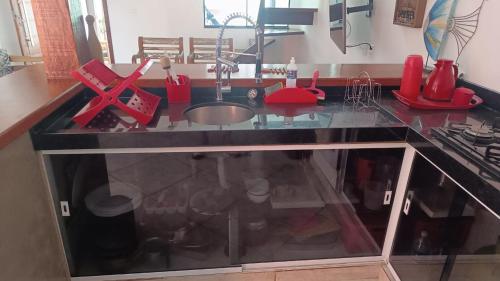 a kitchen counter top with a sink and a counter top at Casa Duas Torres in Búzios