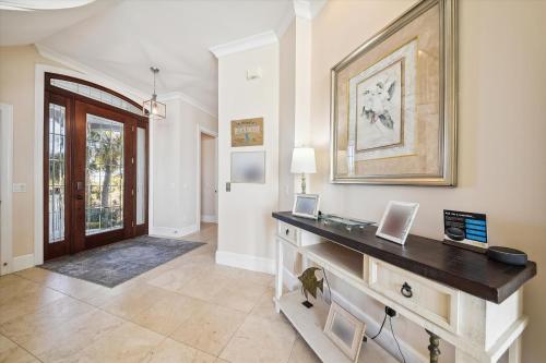 a home office with a desk with two laptops on it at 2 Collier Beach- Oceanfront, Dog Friendly , Private Pool, FREE Activities in Hilton Head Island