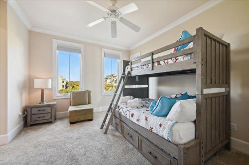 a bedroom with a bunk bed with a ladder at 2 Collier Beach- Oceanfront, Dog Friendly , Private Pool, FREE Activities in Hilton Head Island