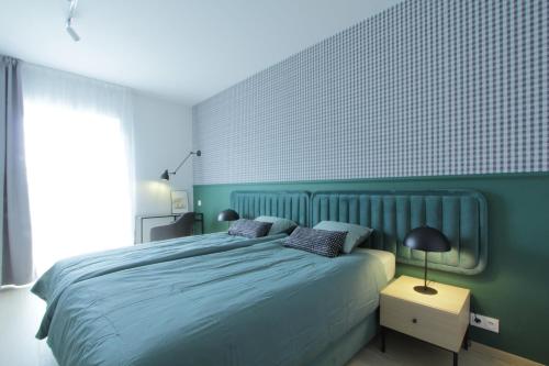 Ένα ή περισσότερα κρεβάτια σε δωμάτιο στο Green apartment strict center