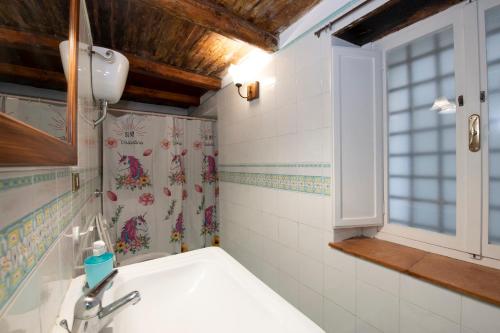 a bathroom with a sink and a window at blue terrace Amalfi in Atrani