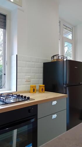 Cuisine ou kitchenette dans l'établissement Il Giardino di Eva - a soli 280m dal treno ferroviario