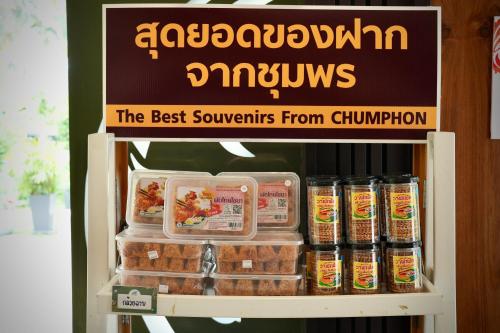 a refrigerator with some food and drinks on a shelf at A-Te Chumphon Hotel - SHA Plus in Chumphon