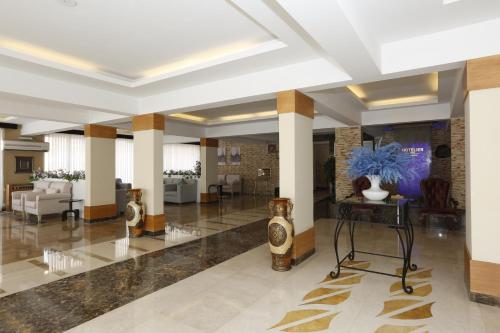 Χώρος καθιστικού στο Hotelier Suites by Cantonal