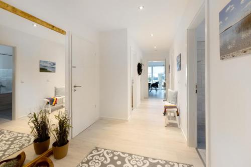 a hallway of a home with white walls at Ferienwohnung 20b am Goitzsche See in Pouch
