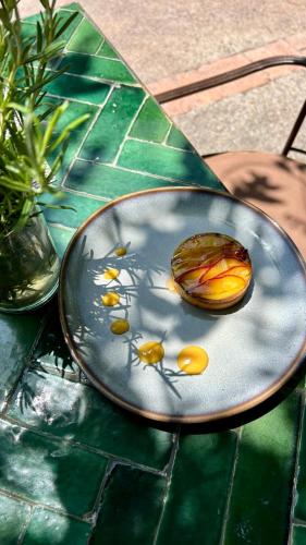 a plate with eggs on it on a table at Domaine de la Roseraie Resort in Ouirgane