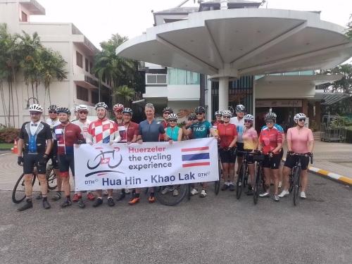 a group of people posing for a picture with a sign at A-Te Chumphon Hotel - SHA Plus in Chumphon
