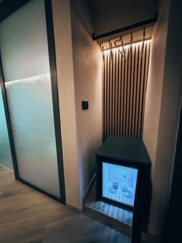 a door to a room with a television in front of it at Talking Stones in Dolceacqua