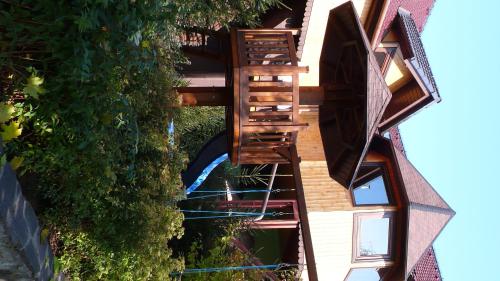 a spiral staircase leading up to a building with plants at Penzion U Holuba in Hradčovice