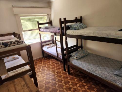 Ένα ή περισσότερα κρεβάτια σε δωμάτιο στο Hostel Capivara's Curitiba