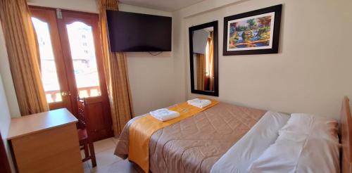 Postel nebo postele na pokoji v ubytování Illari Wari II-Hotel Sauna