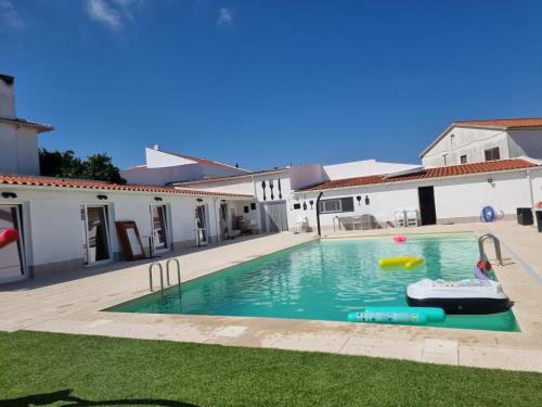 a swimming pool in the backyard of a house at Guest House Azeitão, Wine, Lodge in Villa Nogueira
