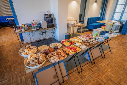 a table filled with lots of different types of food at Naturální vinařství Tomáš Křížek, Penzion Dvorek in Dolní Dunajovice